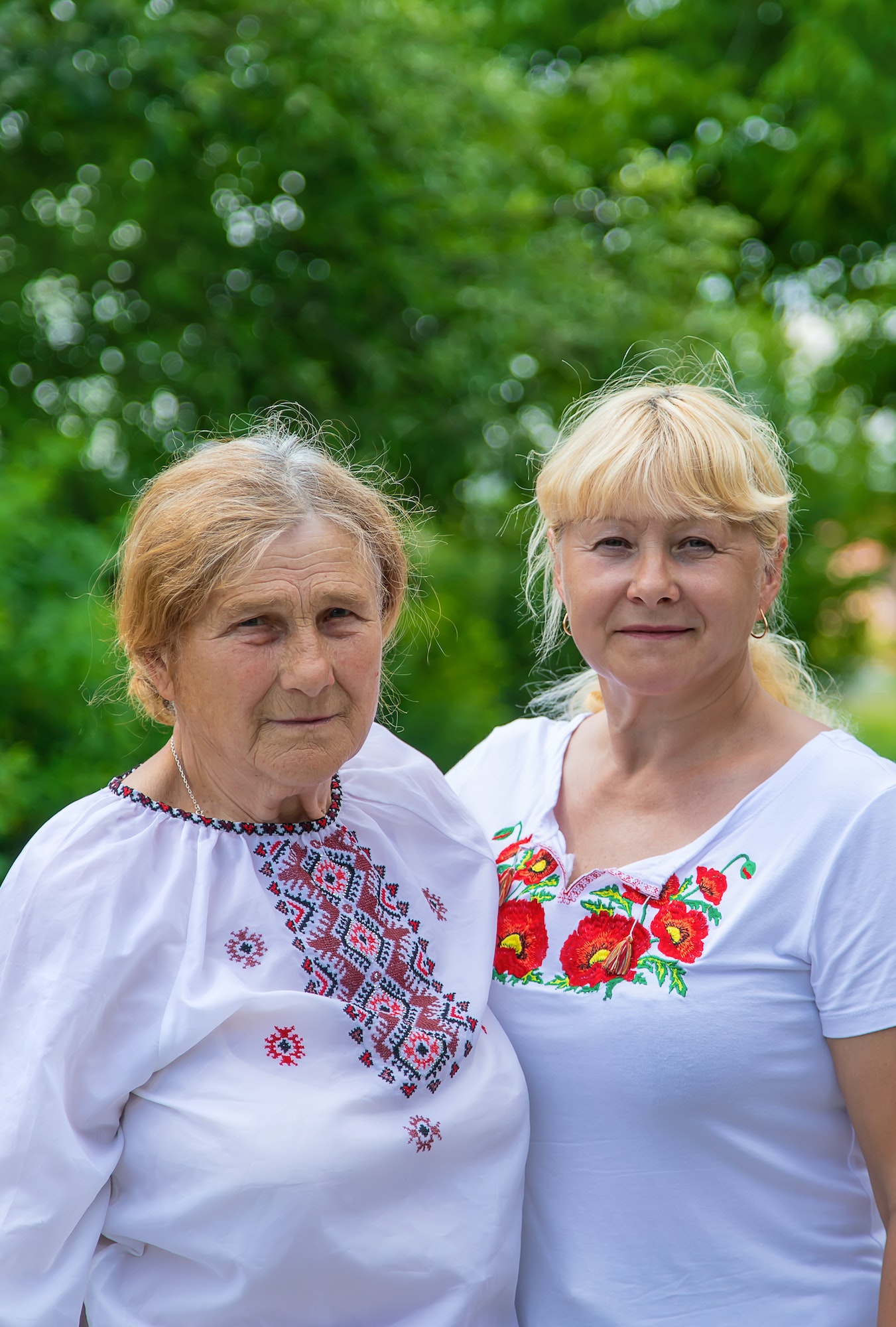 Family photo of a Ukrainian woman in embroidered shirts. Selective focus.